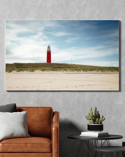 Lighthouse at Texel Netherlands in seashore landscape