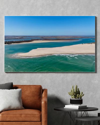 Coorong National Park in South Australia is a coastal wilderness renowned for its vast lagoon system, sand dunes, and pristine natural beauty. This aerial drone footage captures the striking contrast between turquoise waters, winding estuarine