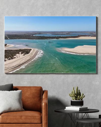 Coorong National Park in South Australia is a coastal wilderness renowned for its vast lagoon system, sand dunes, and pristine natural beauty. This aerial drone footage captures the striking contrast between turquoise waters, winding estuarine