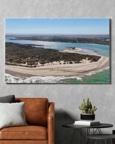 Coorong National Park in South Australia is a coastal wilderness renowned for its vast lagoon system, sand dunes, and pristine natural beauty. This aerial drone footage captures the striking contrast between turquoise waters, winding estuarine