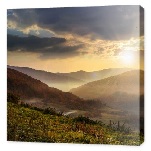 cold fog in mountains at sunset