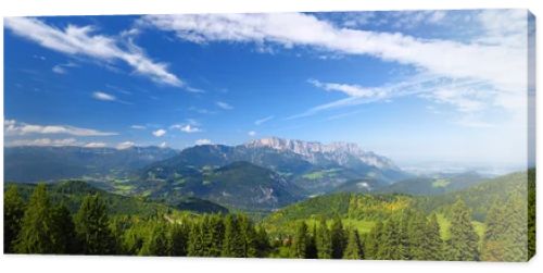 Scenic view of mountains, forests and blue sky