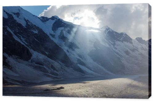 mountains and cloudy sky with sunlight