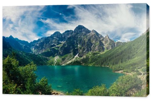 View on the turquoise color lake between high and rocky mountains. Beautiful alpine landscape. 
