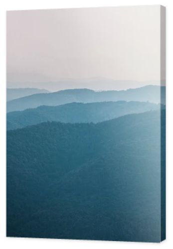 scenic and blue silhouette of mountains outside 