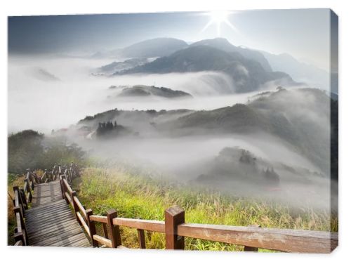 Dramatic clouds with mountain and tree