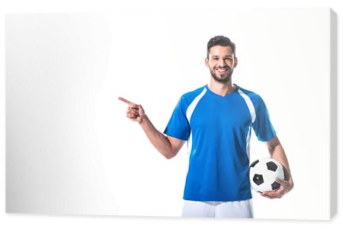 happy soccer player with ball pointing with finger Isolated On White