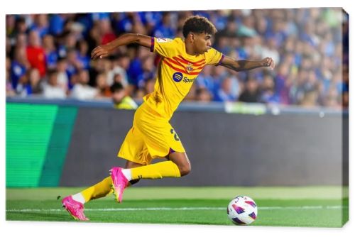 Madrid, Spain- August 13, 2023: Soccer match between Getafe FC and Barcelona FC of the Spanish EA Sports league. Lamine Yamal with the ball. Football players.