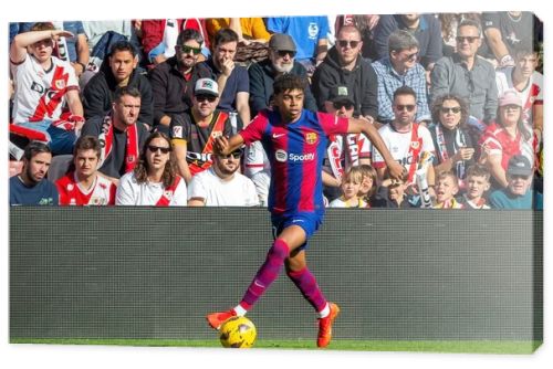 Madrid, Spain- November 25, 2023: League match between Rayo Vallecano and F.C Barcelona in Madrid. Lamine Yamal with the ball. Football players.