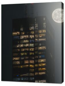 A building and the April pink moon, shot at Boston, the night after full moon night