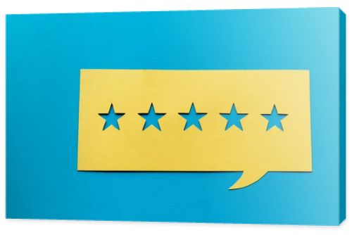 top view of yellow speech bubble with stars isolated on blue 