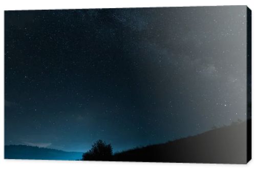 milky way with shining stars on blue sky at night 
