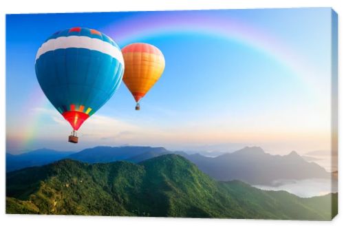 Colorful hot-air balloons flying over the mountain