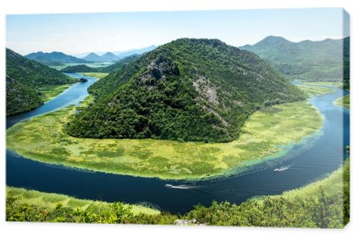 landscape of blue curved Crnojevica River and mountains in Montenegro