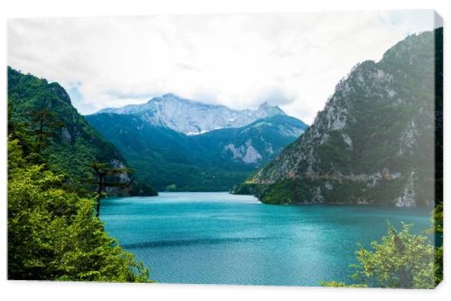 landscape of beautiful Piva Lake, mountains and clouds in Montenegro