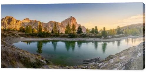 Panorama of the lake Lago di Limedes with the reflection of the surrounding mountains