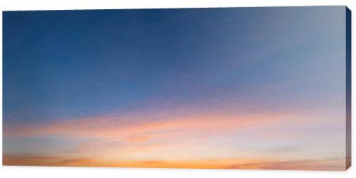 The morning sky looked like a bright golden sky. The sunrise is decorated with clouds in various shapes. Looks beautiful.