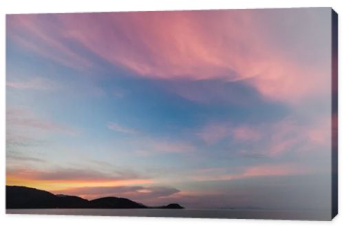 beautiful sunset seascape under pink cloudy sky