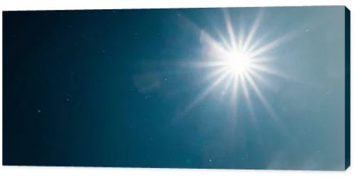 scenic view of bright sun shining in pure dark blue sky, panoramic shot