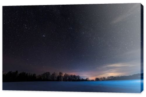 dark sky full of shiny stars in carpathian mountains in winter at night