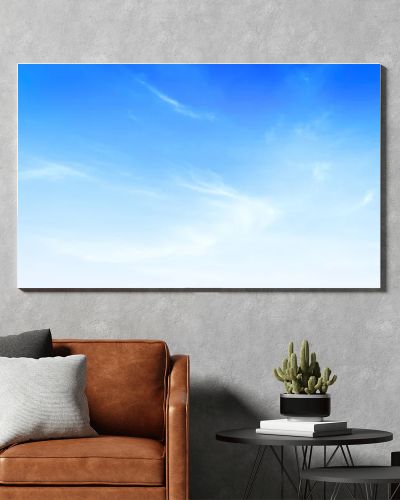 Panoramic bright blue sky background with soft white wispy clouds. Clear sunny day atmosphere. Beautiful natural cloudscape, perfect for summer themes, web banners, and outdoor backdrops. Professional nature photography.