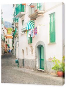 narrow european street with ceramic decorations