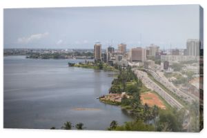 Abidjan, the economical capital of Ivory Coast (Cote d'Ivoire), it's business area Plateau with the Atlantic ocean bay in the background. April 2013