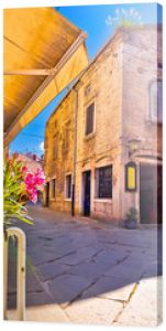 Sunny stone street of ancient Pula view