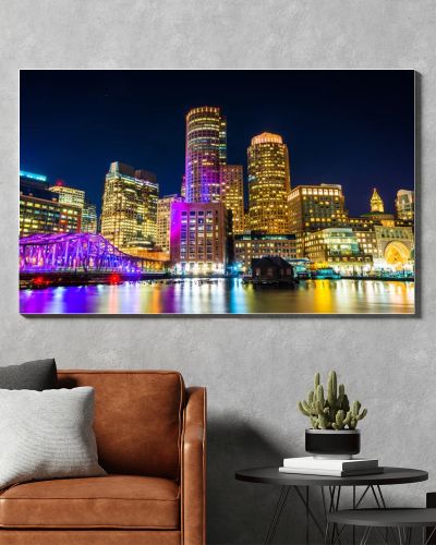 The Boston skyline and Fort Point Channel at night from Fan Pier