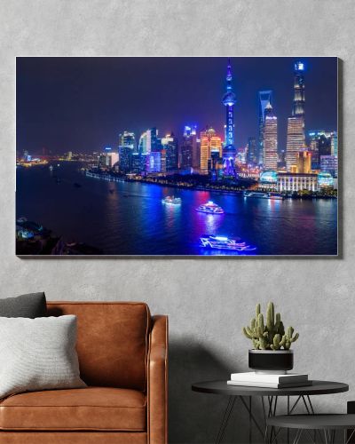Aerial view Shanghai city skyline and skyscraper, Shanghai modern city at night in China on the Huangpu River.