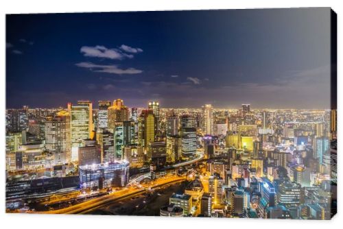 Aerial view of the Osaka cityscape at night from the observation platform at the Umeda sky building.