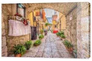 Alleyway in old white town Bari