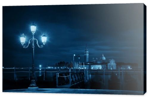 Venice at night with street lamp and San Giorgio Maggiore church in Italy.