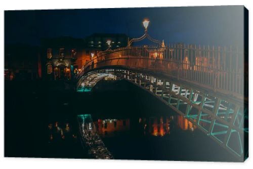 Dublin, Ireland. Night view of famous illuminated Ha Penny Bridg