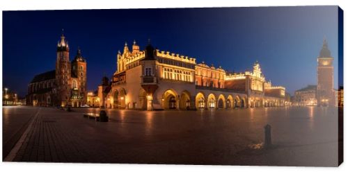 Cloth Hall Sukiennice building and main square of the old town illuminated at night on main square of Cracow. Poland  Panoramic view
