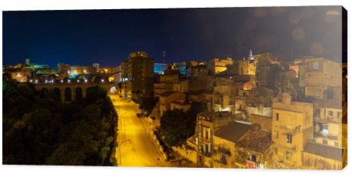 Night old medieval Ragusa famous Sicilian town view (Sicily, Italy). Unesco world heritage site. Some lens flares from nearest city lights enable.