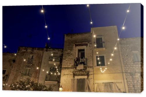  Night view in amazing Old Town , historical center of Bari , Italy. Street Casamassimi .