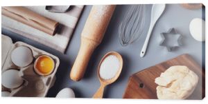 Flat layout composition, baking ingredients and kitchen utensils on a gray background. Culinary trendy background. The concept of making homemade desserts for the holiday