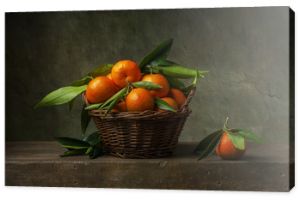 Still life with tangerines in a basket on the table