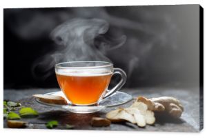 Hot Ginger tea in a glass on wood background.Hot drink . Copy space.