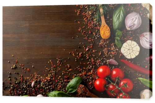 Different cooking ingredients and spices on wooden background