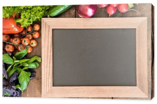 chalkboard with group of fresh vegetables 