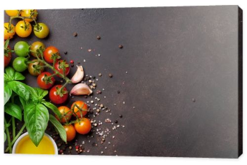 Tomatoes, basil and spices on stone table. Cooking concept. Top view with space for your text