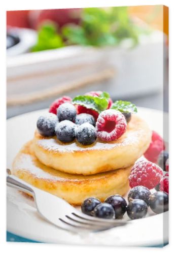 Cottage cheese pancakes, syrniki, curd fritters with berries