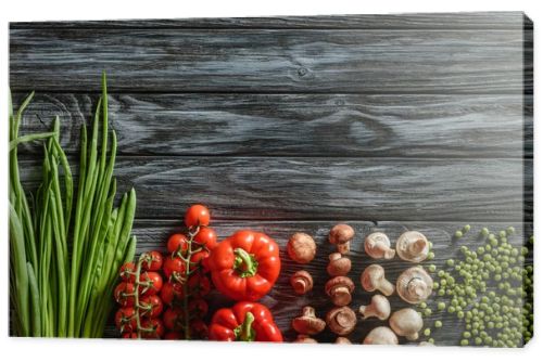 top view of various raw vegetables on wooden tabletop