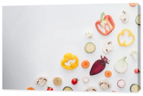 top view of slices of fresh healthy vegetables isolated on white background 