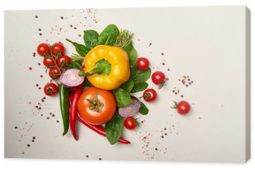 Top view of fresh vegetables and spices on grey background