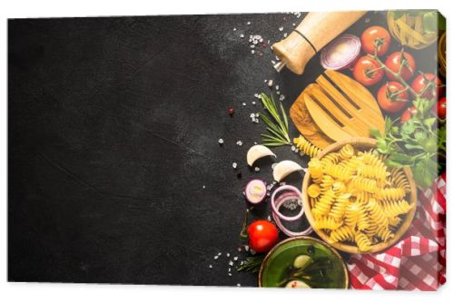 Food cooking background. Italian food, pasta ingredient. Top view on black stone table.