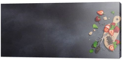 Refreshing summer drink. Dry tea leaves, fresh fruit and herbs. Set of ingredients for preparation tea, hard light, dark shadow. Dark stone concrete background, flat lay, banner format