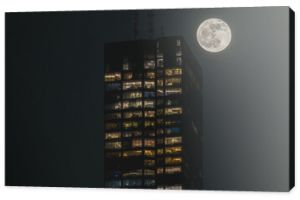 A building and the April pink moon, shot at Boston, the night after full moon night